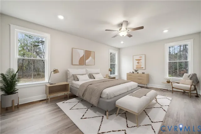 a dining room with furniture window and wooden floor