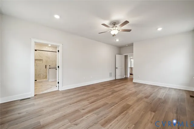 a bedroom with a bed and glass window