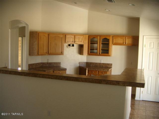 940 Paseo Escoba Rio Rico, AZ 85648 - Photo 6 of 25 a view of a refrigerator a sink and a window