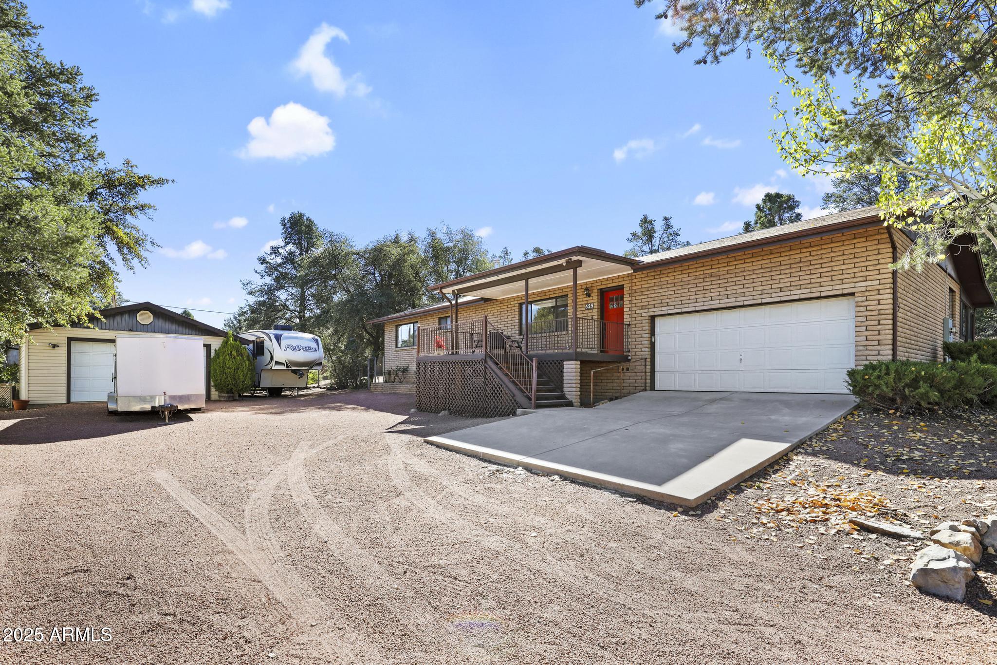 625 East Coronado Way Payson, AZ 85541 - Photo 2 of 25 a front view of a house with a yard and garage