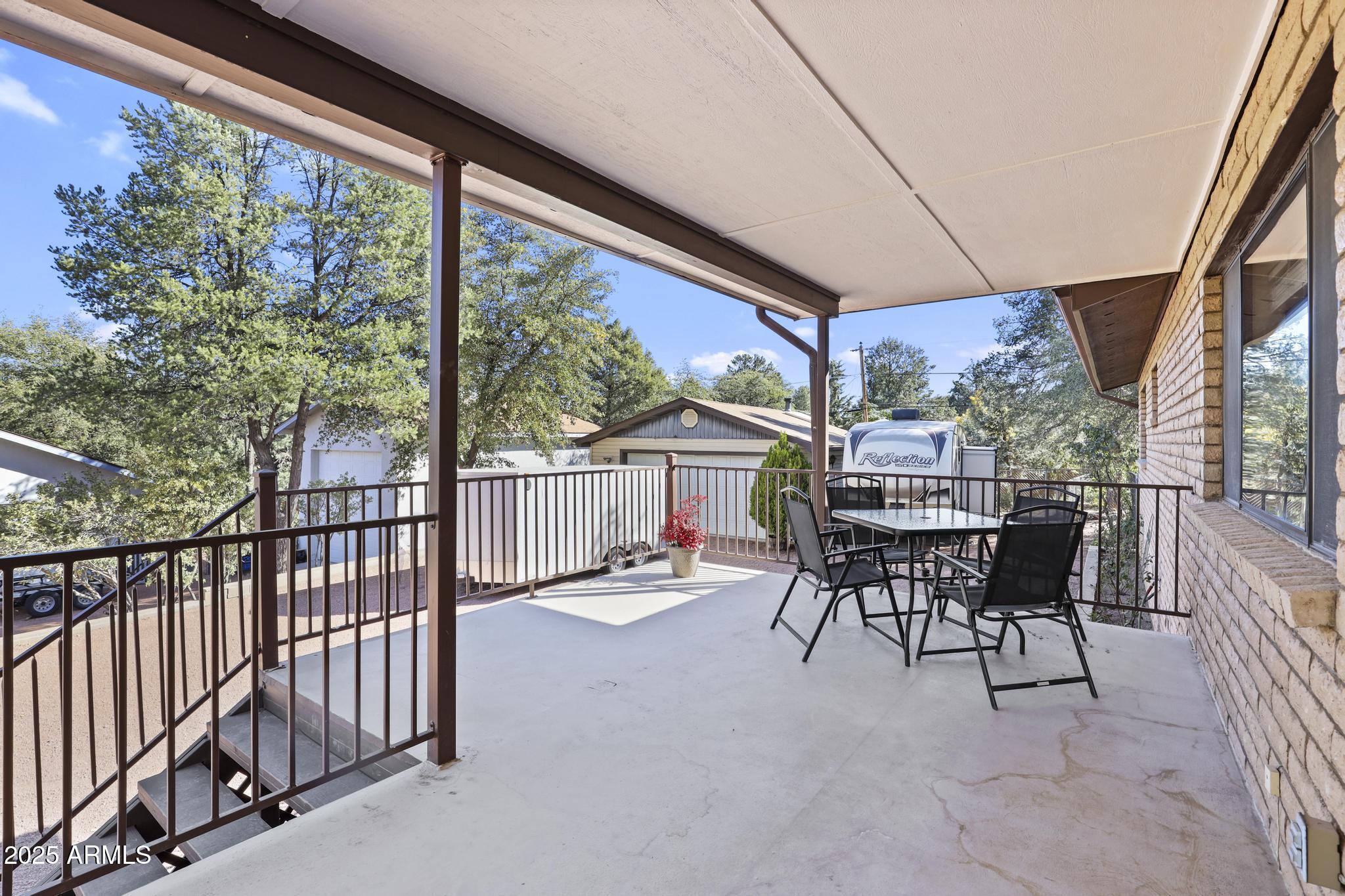 625 East Coronado Way Payson, AZ 85541 - Photo 22 of 25 a view of a patio with a table chairs and backyard