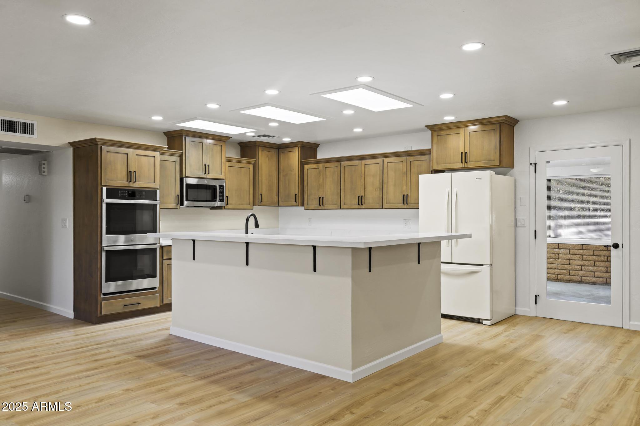 625 East Coronado Way Payson, AZ 85541 - Photo 4 of 25 a kitchen with stainless steel appliances kitchen island granite countertop a refrigerator and a stove top oven