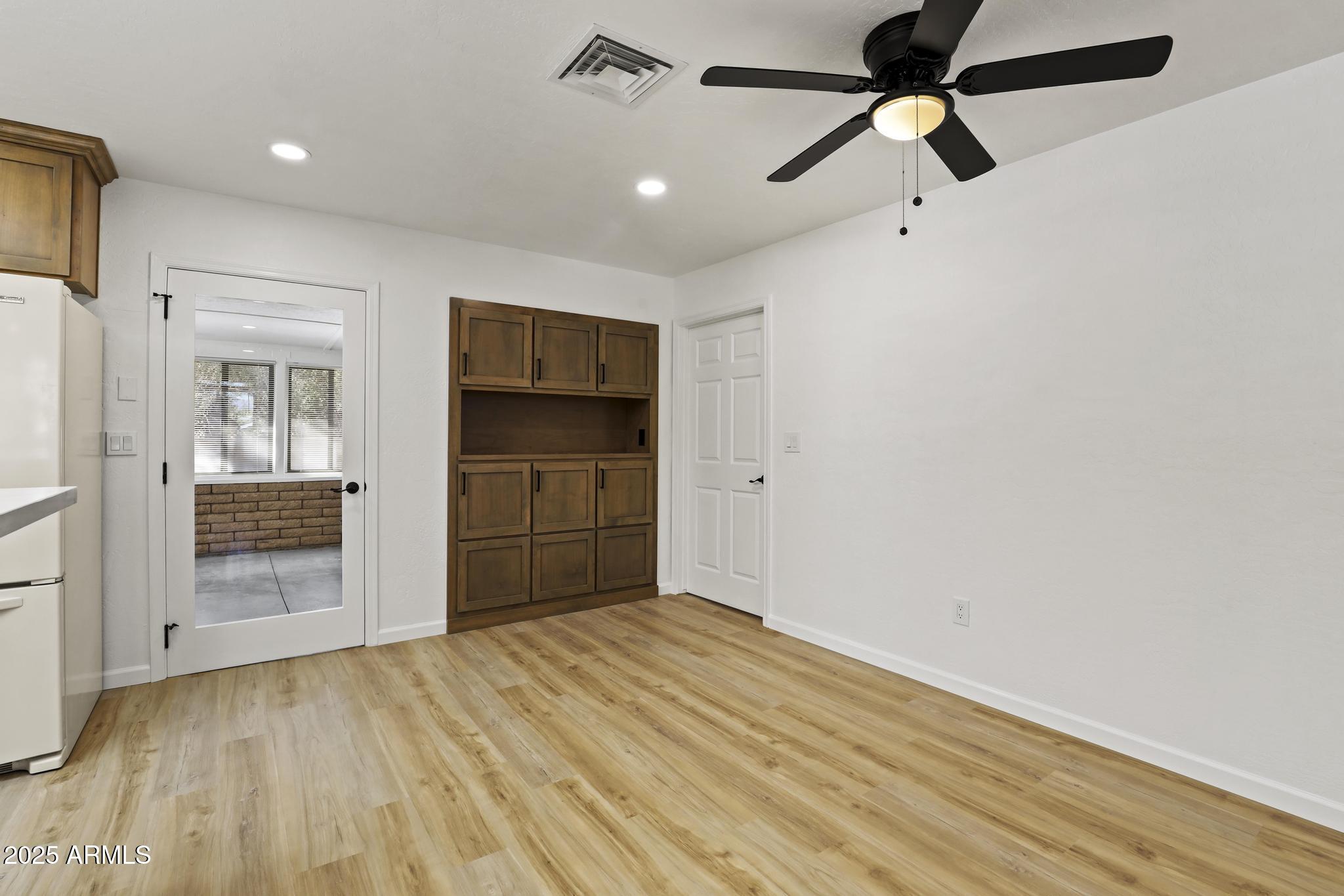 625 East Coronado Way Payson, AZ 85541 - Photo 9 of 25 a view of empty room with wooden floor and window