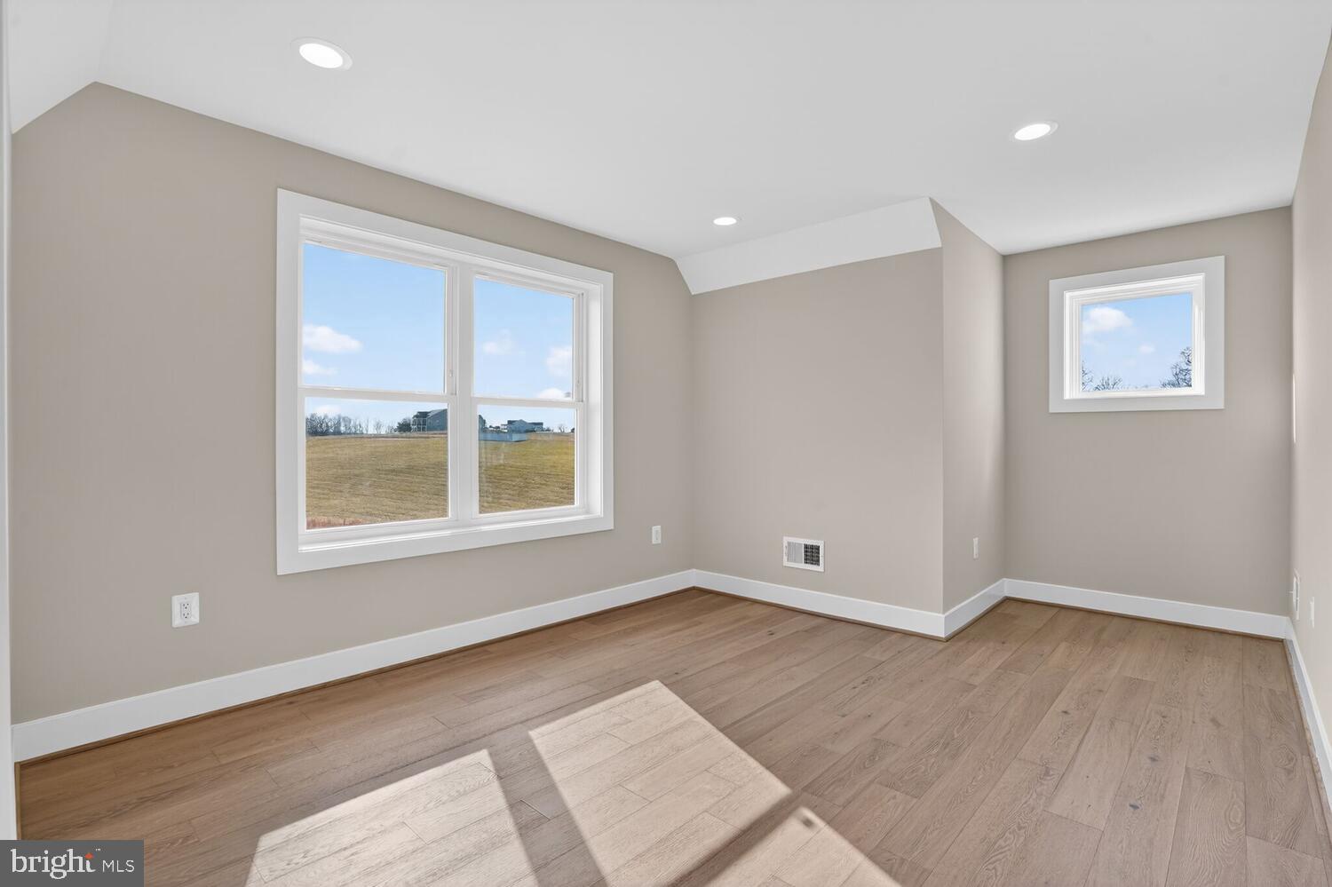 393 Rock Island Ridge Mineral, VA 23117 - Photo 18 of 97 an empty room with wooden floor and windows