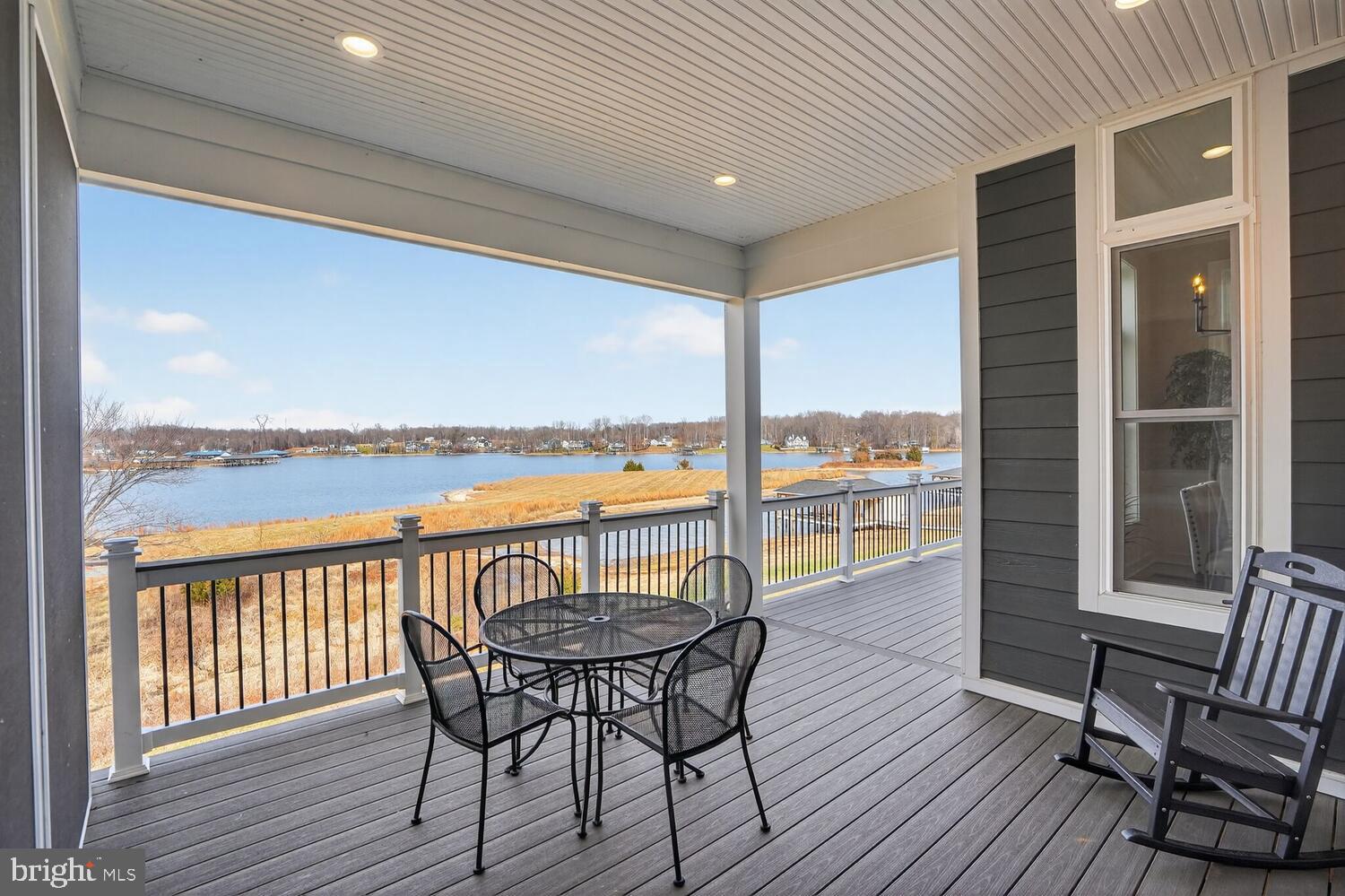 393 Rock Island Ridge Mineral, VA 23117 - Photo 31 of 97 a view of a balcony with lake view and wooden floor