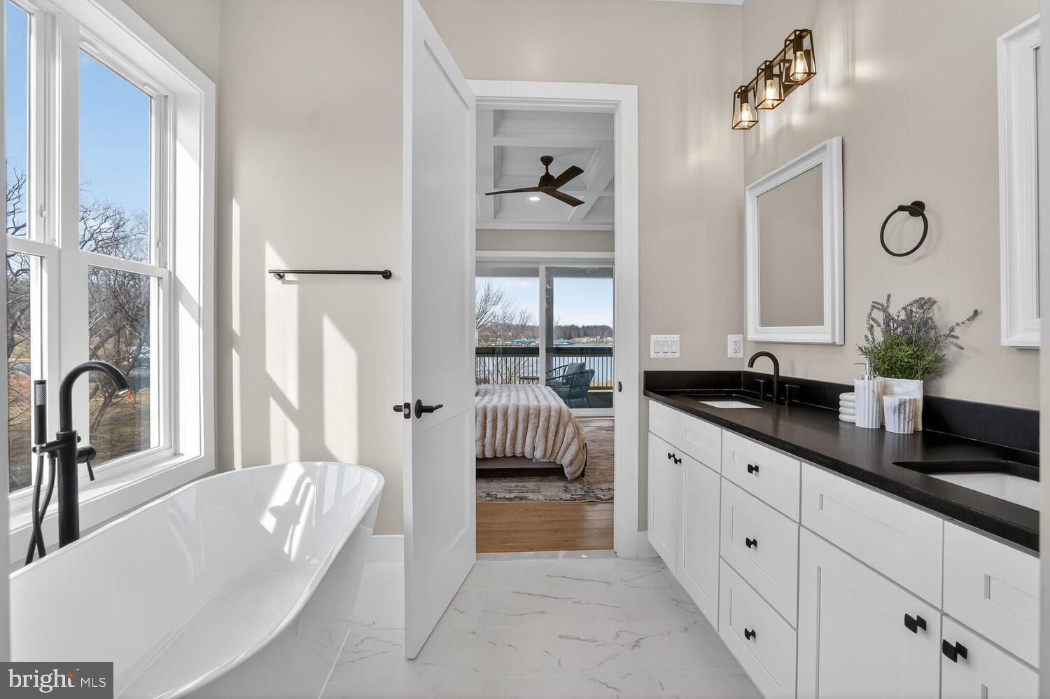 393 Rock Island Ridge Mineral, VA 23117 - Photo 41 of 97 a spacious bathroom with a bathtub double sink and mirror