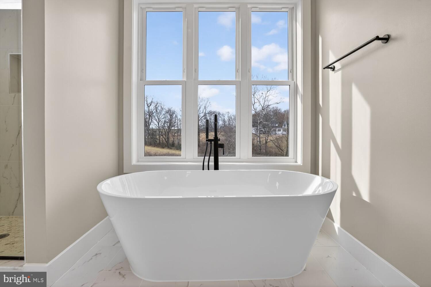 393 Rock Island Ridge Mineral, VA 23117 - Photo 43 of 97 a white bath tub sitting in a bathroom next to a window