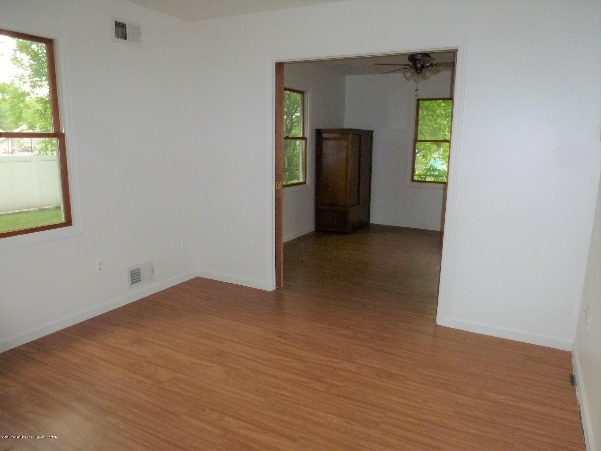 363 Lloyd Road Aberdeen, NJ 07747 - Photo 6 of 17 Pocket Doors between 2 Added Rooms
