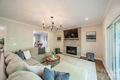 a living room with furniture fireplace and a flat screen tv