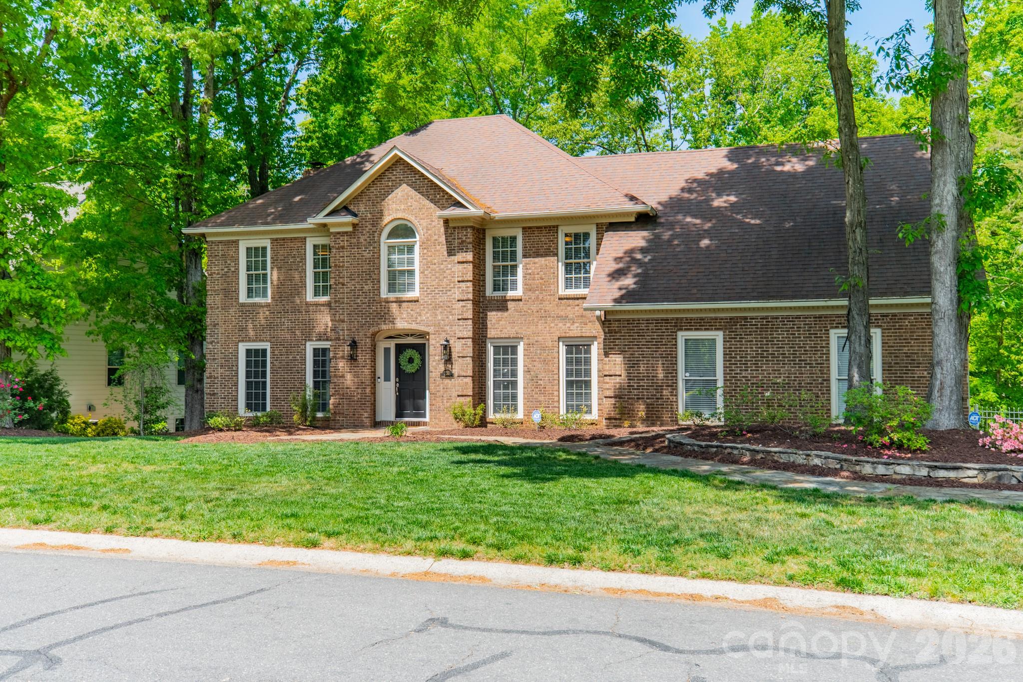 231 South Downs Way Fort Mill, SC 29708 - Photo 2 of 48 a front view of a house with a yard and trees