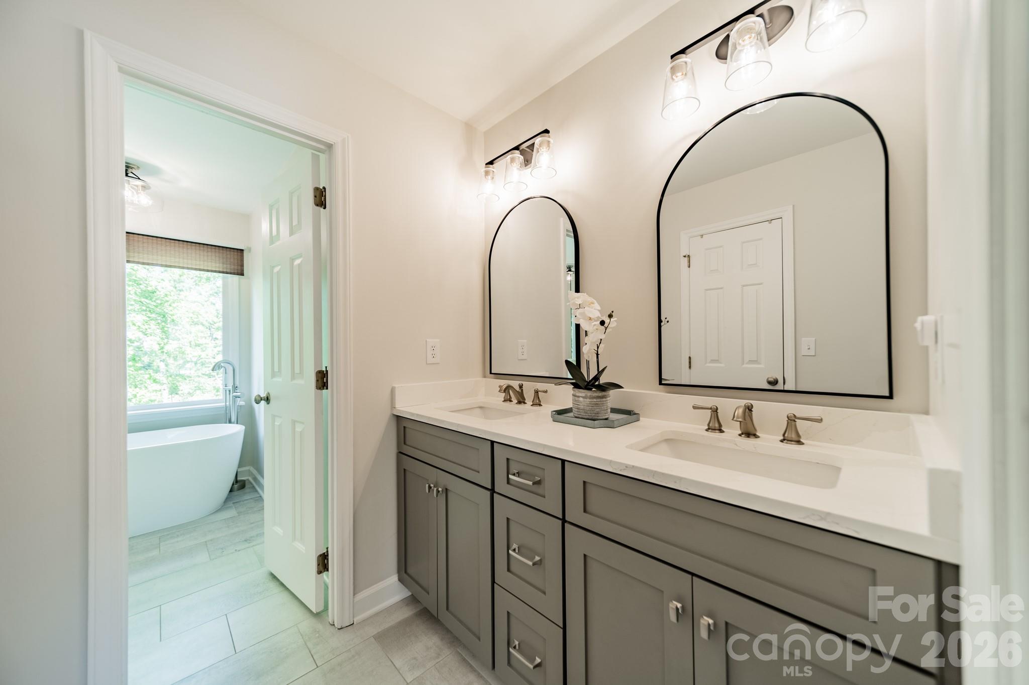 231 South Downs Way Fort Mill, SC 29708 - Photo 28 of 48 a bathroom with a double vanity sink and a mirror