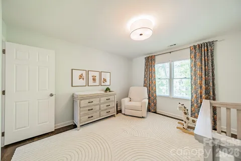 a bed room with a bed and a window