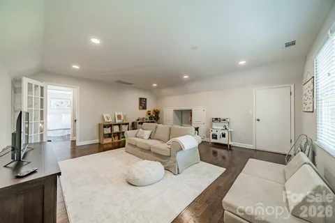 a living room with furniture window and a table