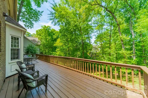 a view of balcony with furniture and wooden deck