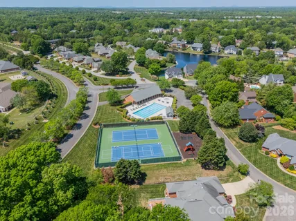 an aerial view of multiple houses with yard