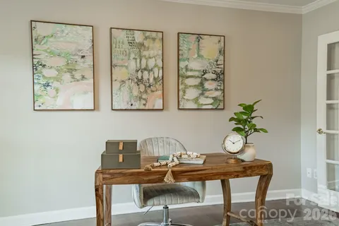 a view of a workspace with furniture