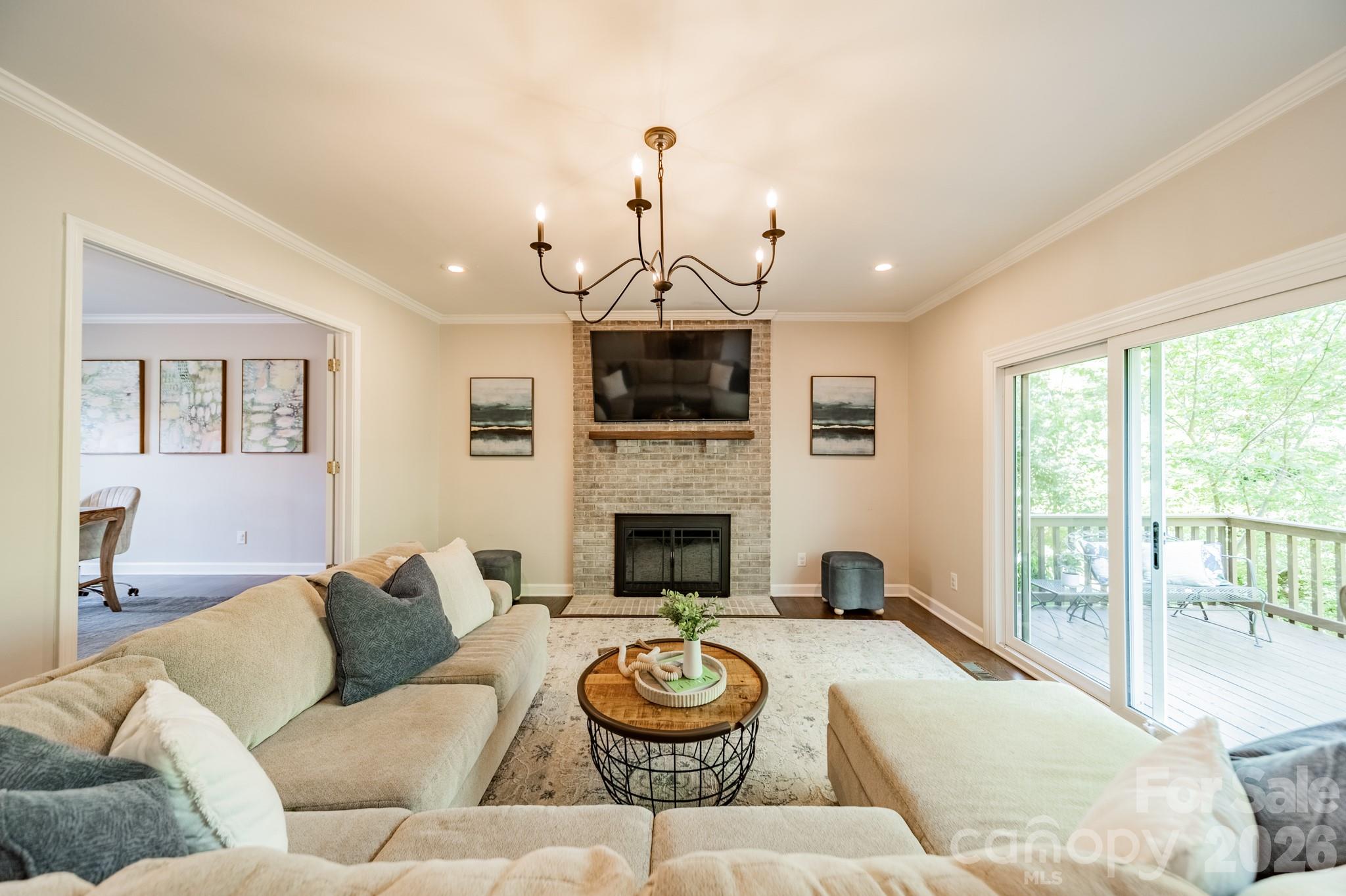 231 South Downs Way Fort Mill, SC 29708 - Photo 10 of 48 a living room with furniture a fireplace and a large window