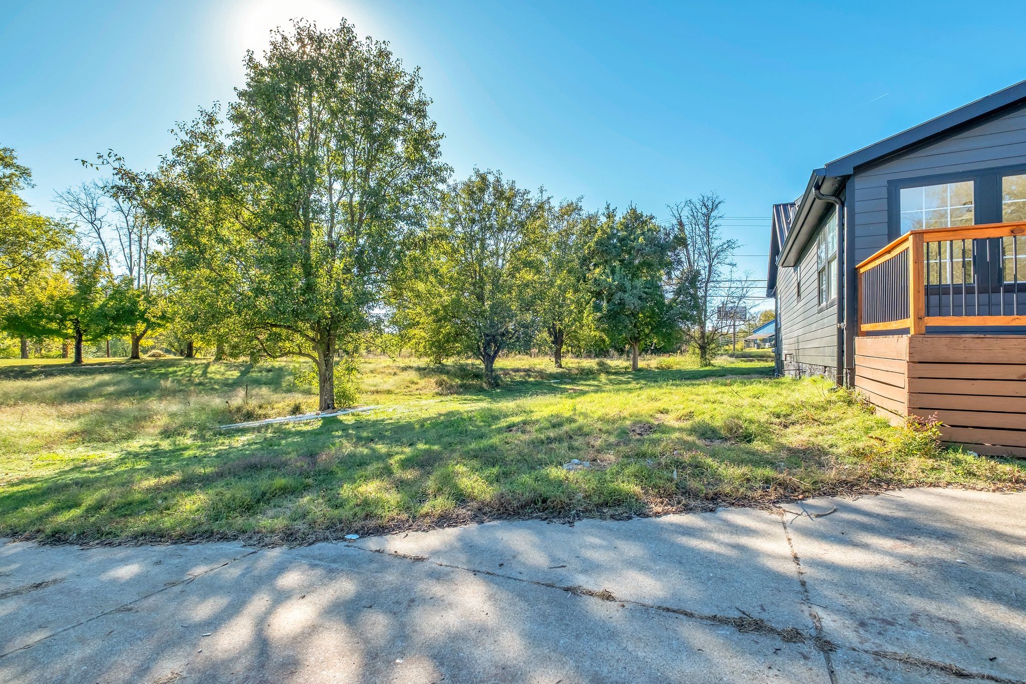 568 West Campbell Road Goodlettsville, TN 37072 - Photo 24 of 27 a view of a yard with plants and large trees