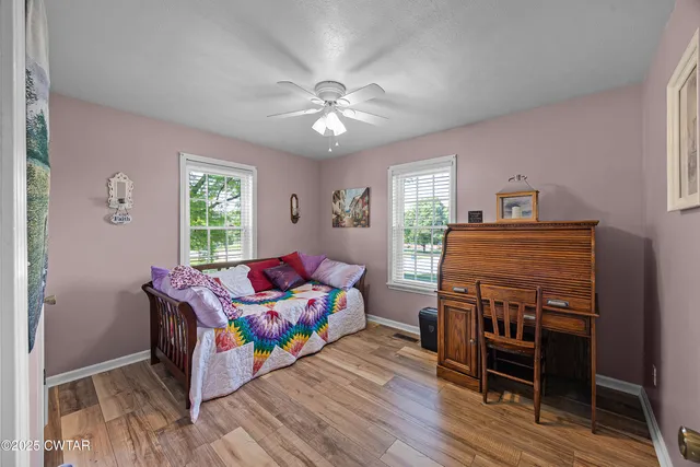 a bedroom with a bed and a table in it