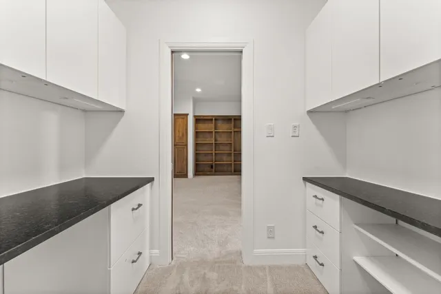 a utility room with cabinets