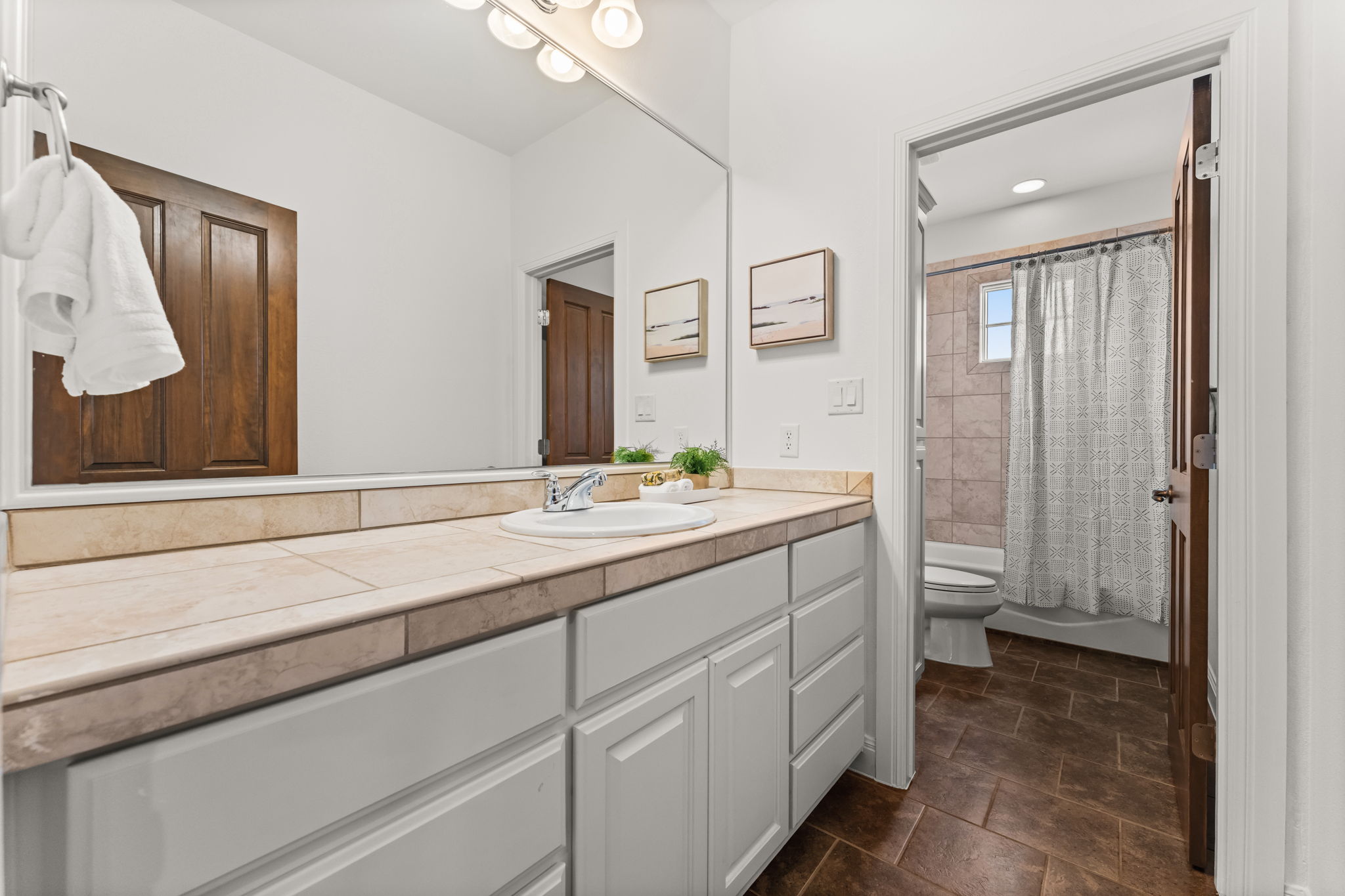 15 Borello Drive Austin, TX 78738 - Photo 25 of 36 a bathroom with a sink and a mirror