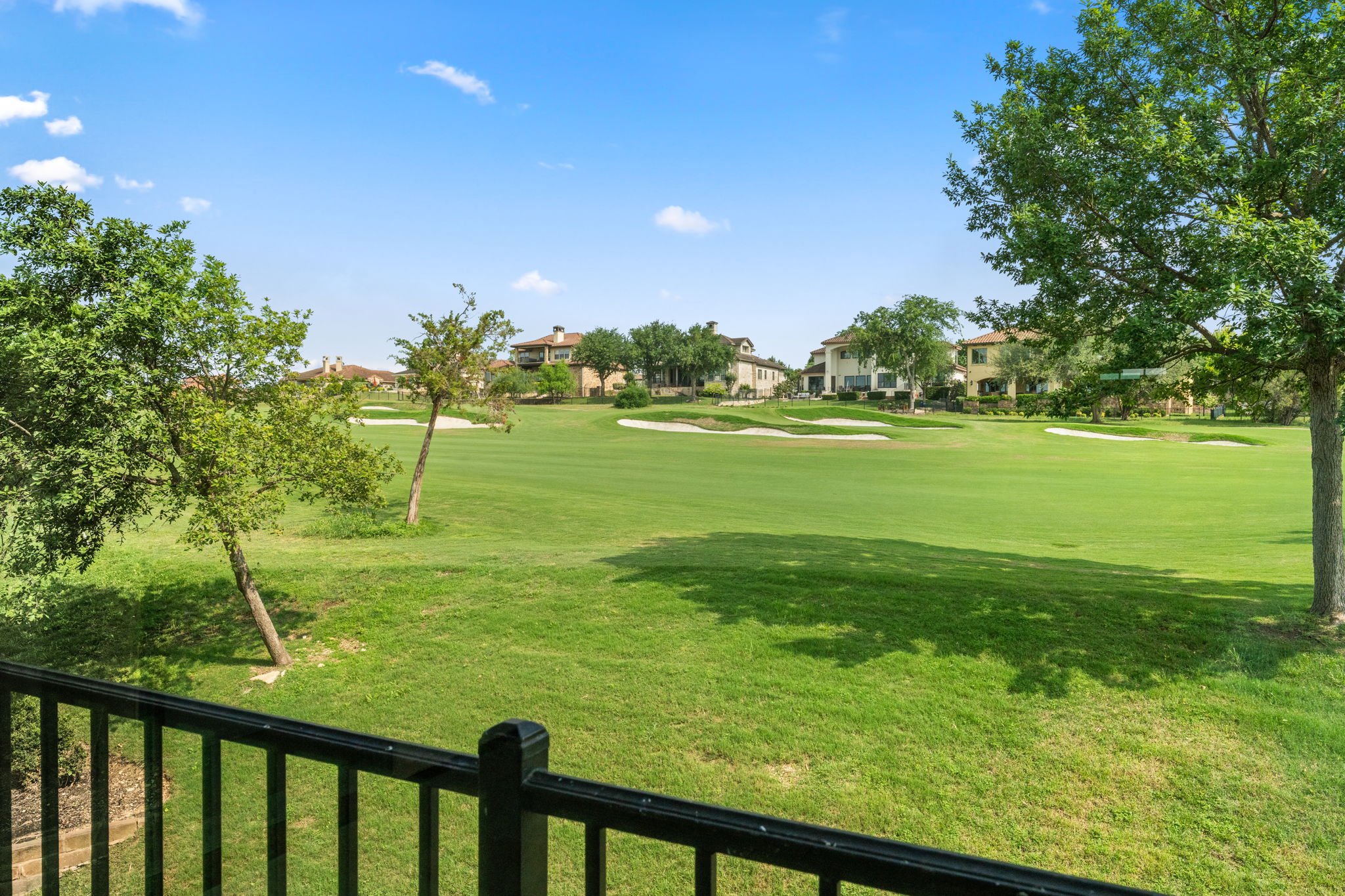 15 Borello Drive Austin, TX 78738 - Photo 30 of 36 a view of an ocean from a balcony
