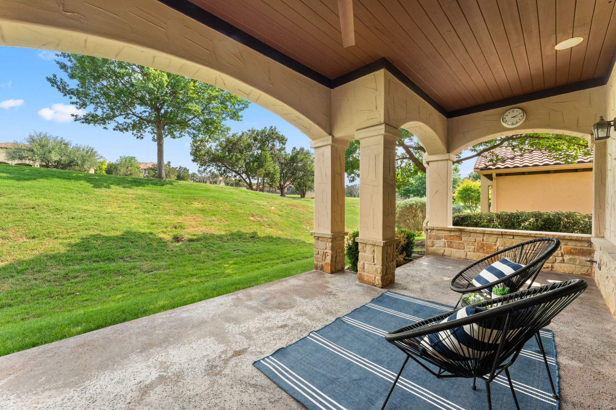 15 Borello Drive Austin, TX 78738 - Photo 31 of 36 a view of a patio with table and chairs potted plants with wooden floor and fence