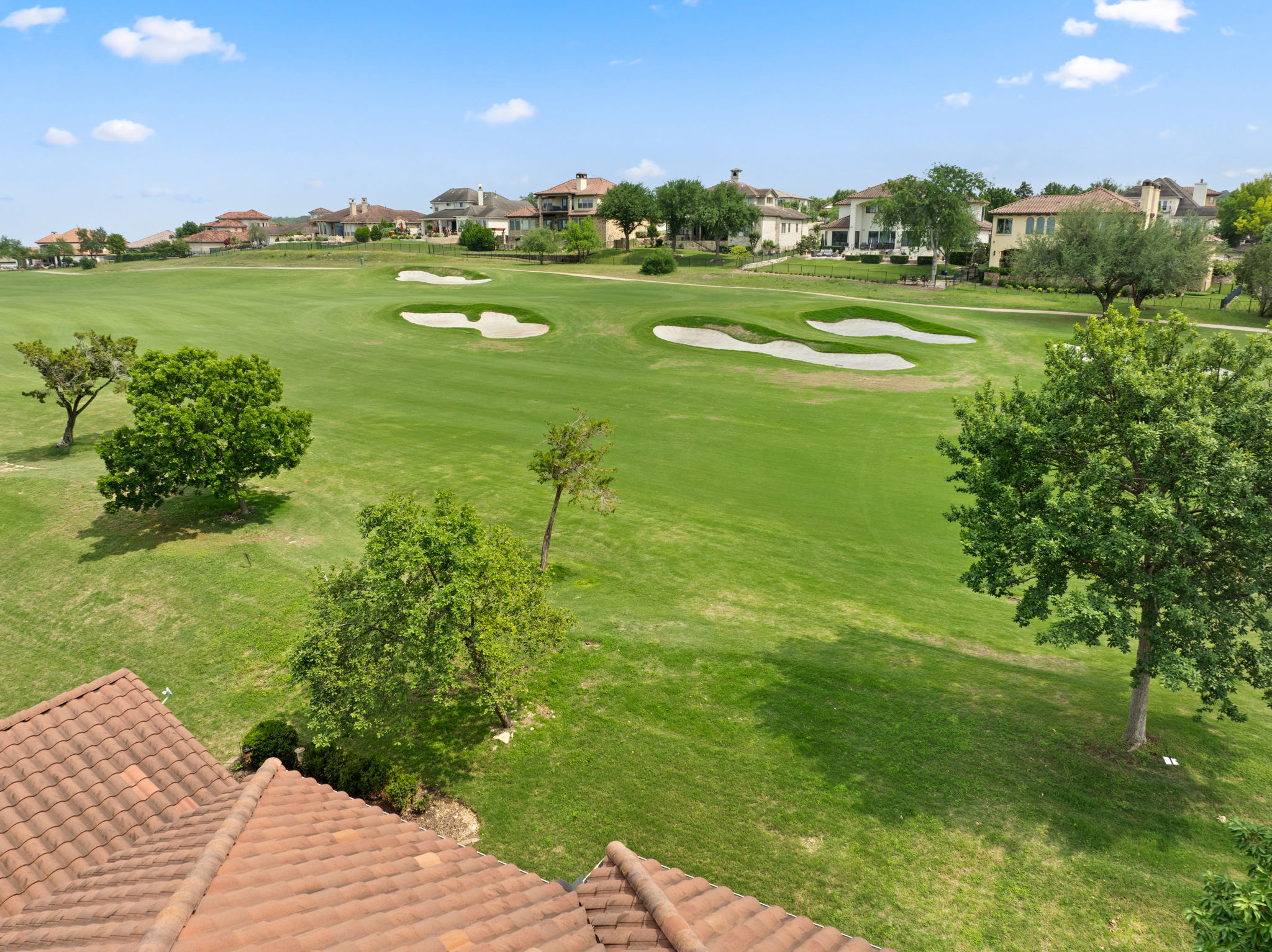 15 Borello Drive Austin, TX 78738 - Photo 33 of 36 a view of a golf course with a lake