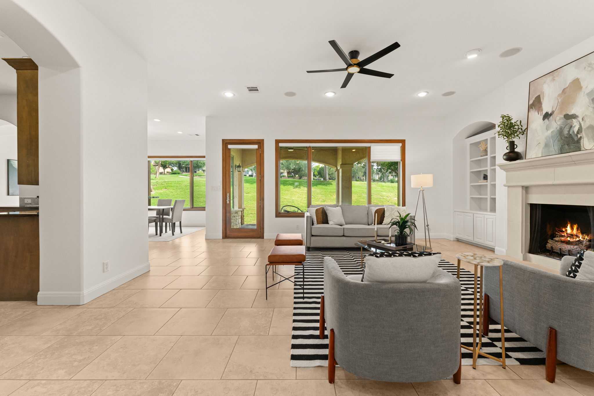 15 Borello Drive Austin, TX 78738 - Photo 7 of 36 a living room with furniture and a fireplace