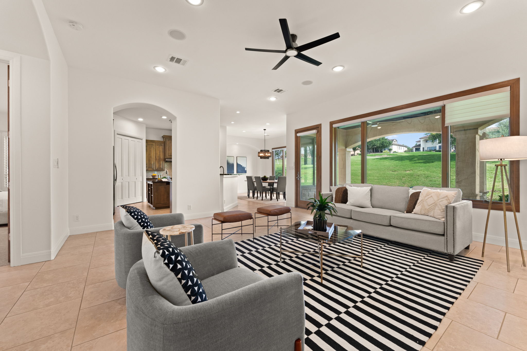 15 Borello Drive Austin, TX 78738 - Photo 8 of 36 a living room with furniture and a large window