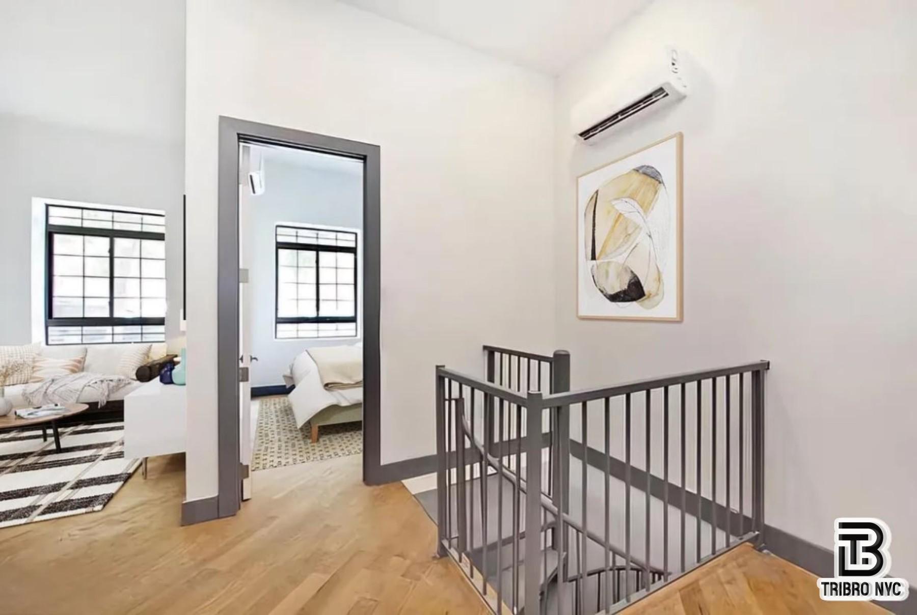 378 South 3rd Street, Unit 1S Brooklyn, NY 11211 - Photo 1 of 6 a view of a hallway with bedroom and wooden floor