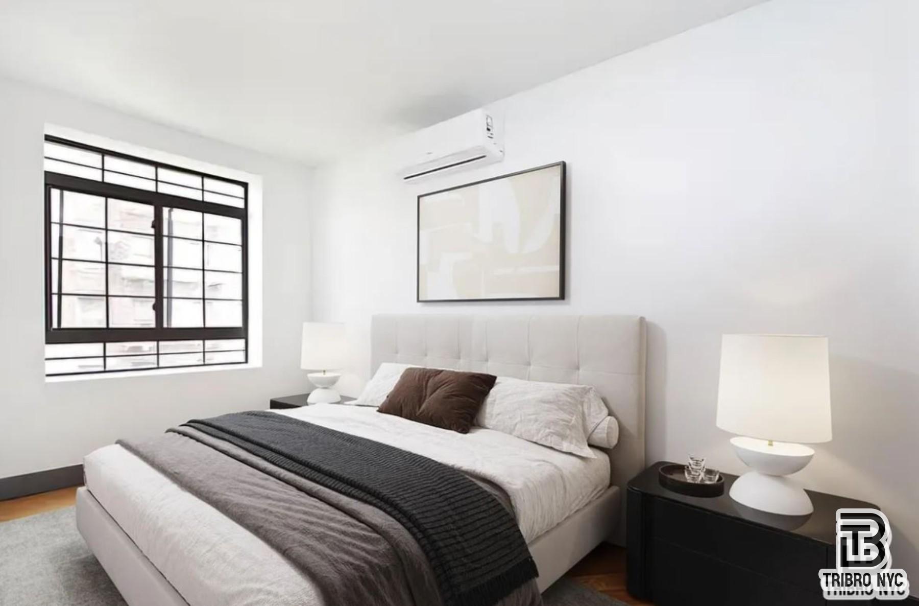378 South 3rd Street, Unit 1S Brooklyn, NY 11211 - Photo 2 of 6 a bedroom with a bed and a window
