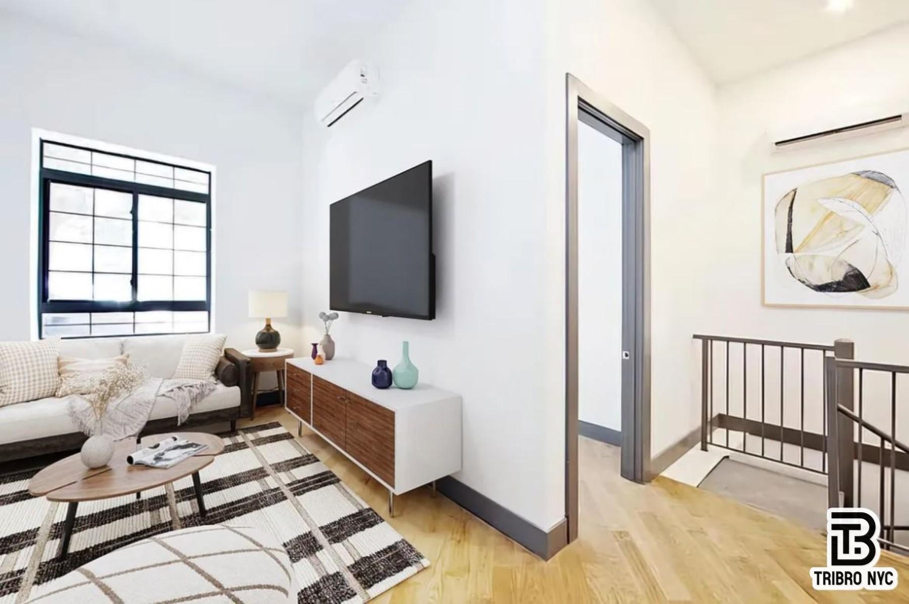378 South 3rd Street, Unit 1S Brooklyn, NY 11211 - Photo 4 of 6 a living room with furniture and a flat screen tv