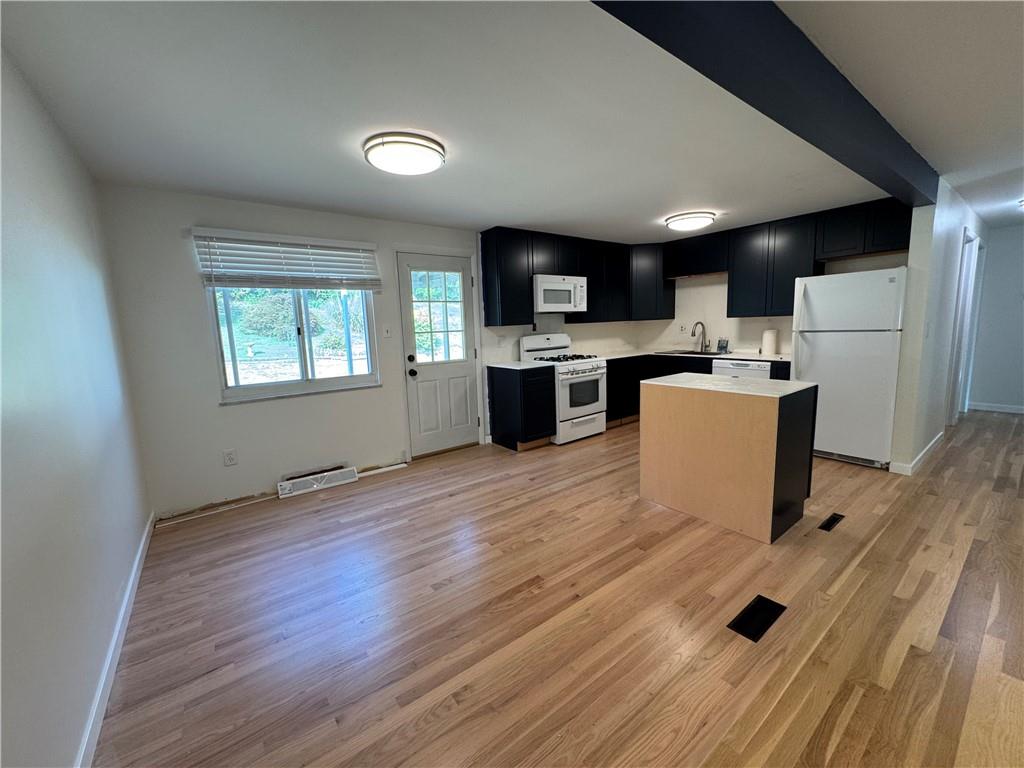 111 Tree View Drive Coraopolis, PA 15108 - Photo 11 of 29 a living room with stainless steel appliances wooden floors kitchen view and a window