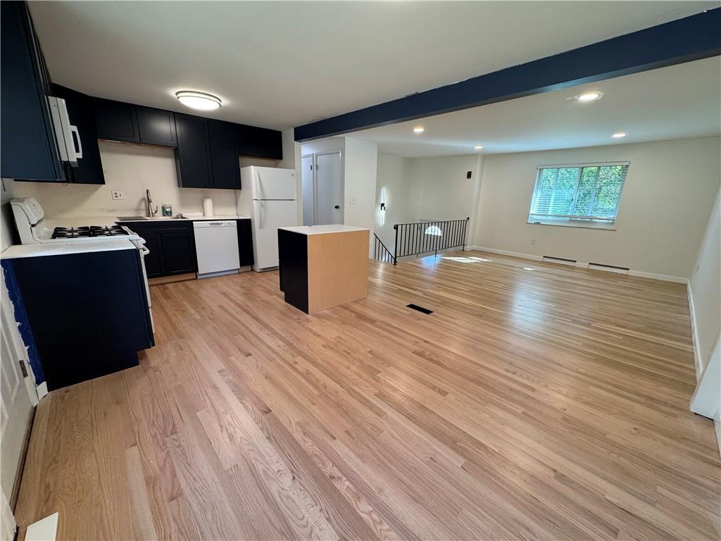 111 Tree View Drive Coraopolis, PA 15108 - Photo 12 of 29 a open kitchen with kitchen island white cabinets and stainless steel appliances