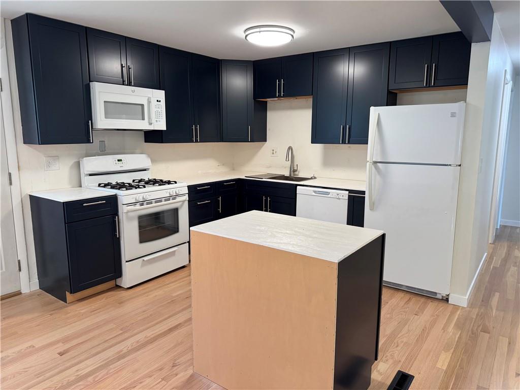 111 Tree View Drive Coraopolis, PA 15108 - Photo 13 of 29 a kitchen with a stove a refrigerator and a microwave