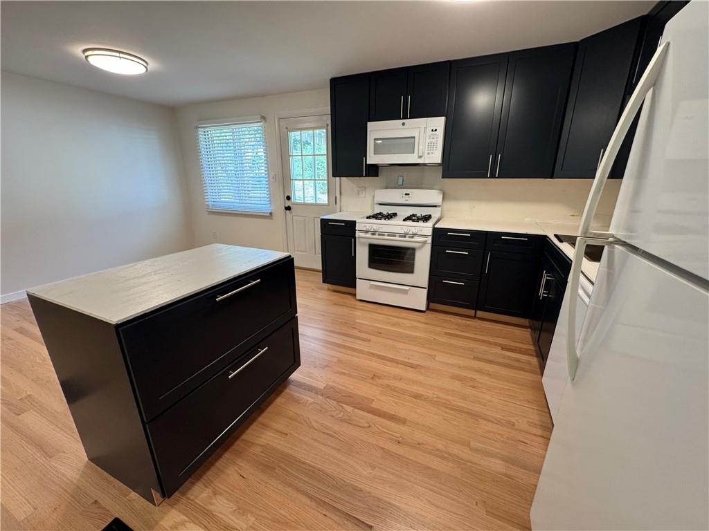 111 Tree View Drive Coraopolis, PA 15108 - Photo 15 of 29 a room with furniture a flat screen tv and a refrigerator