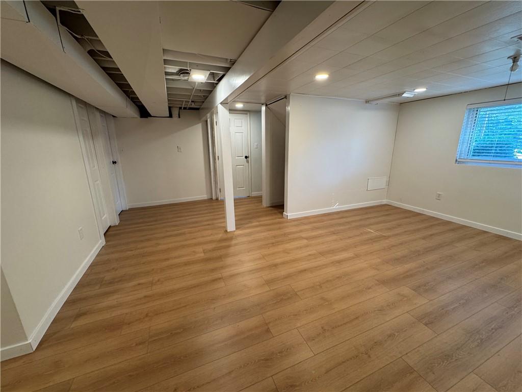 111 Tree View Drive Coraopolis, PA 15108 - Photo 28 of 29 an empty room with wooden floor and windows