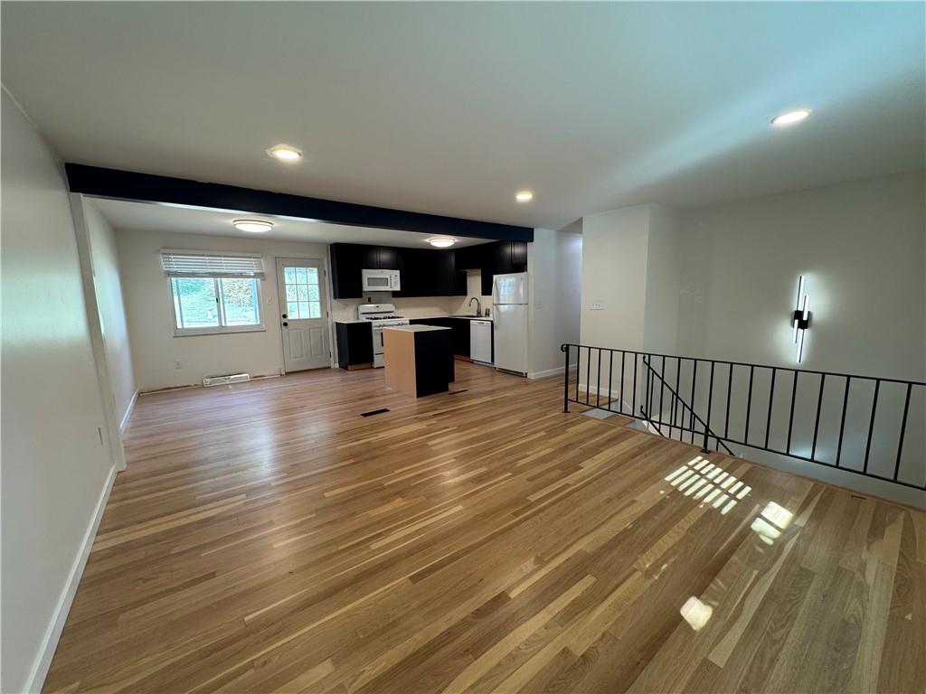 111 Tree View Drive Coraopolis, PA 15108 - Photo 10 of 29 a view of a living room a dining room with wooden floor and a window
