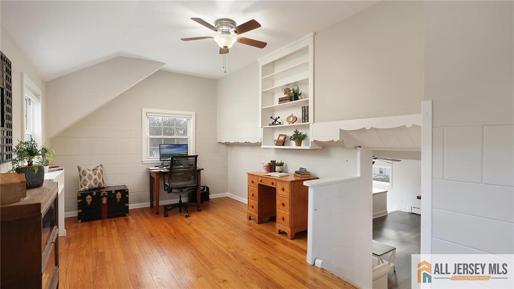333 Melrose Avenue Middlesex, NJ 08846 - Photo 13 of 36 a living room with furniture and a wooden floor