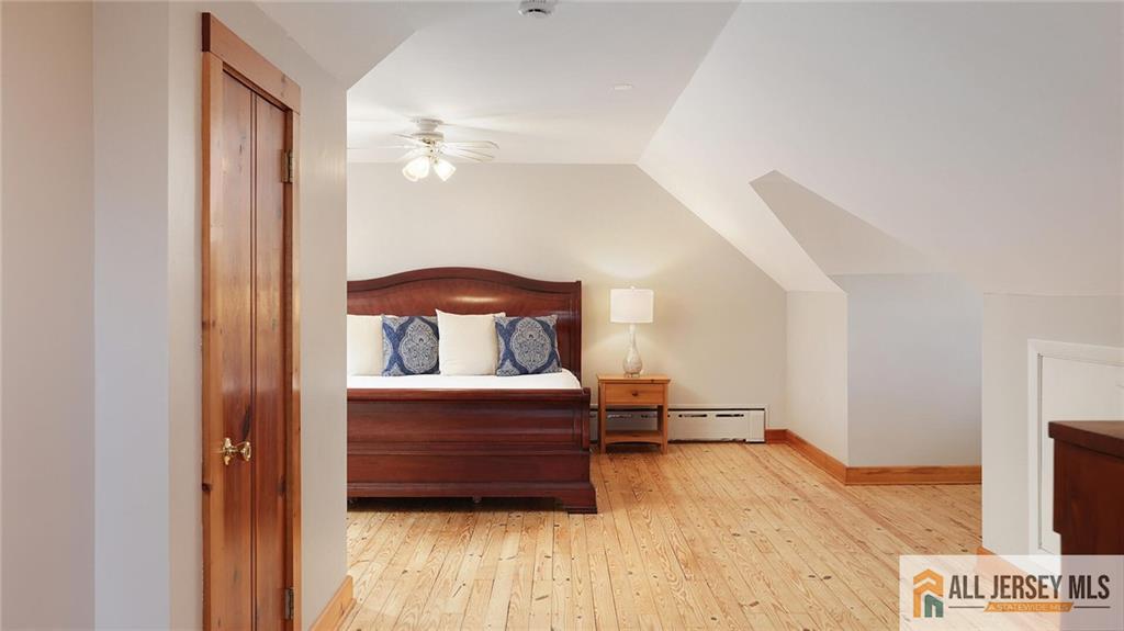 333 Melrose Avenue Middlesex, NJ 08846 - Photo 23 of 36 a bedroom with a bed and a mirror