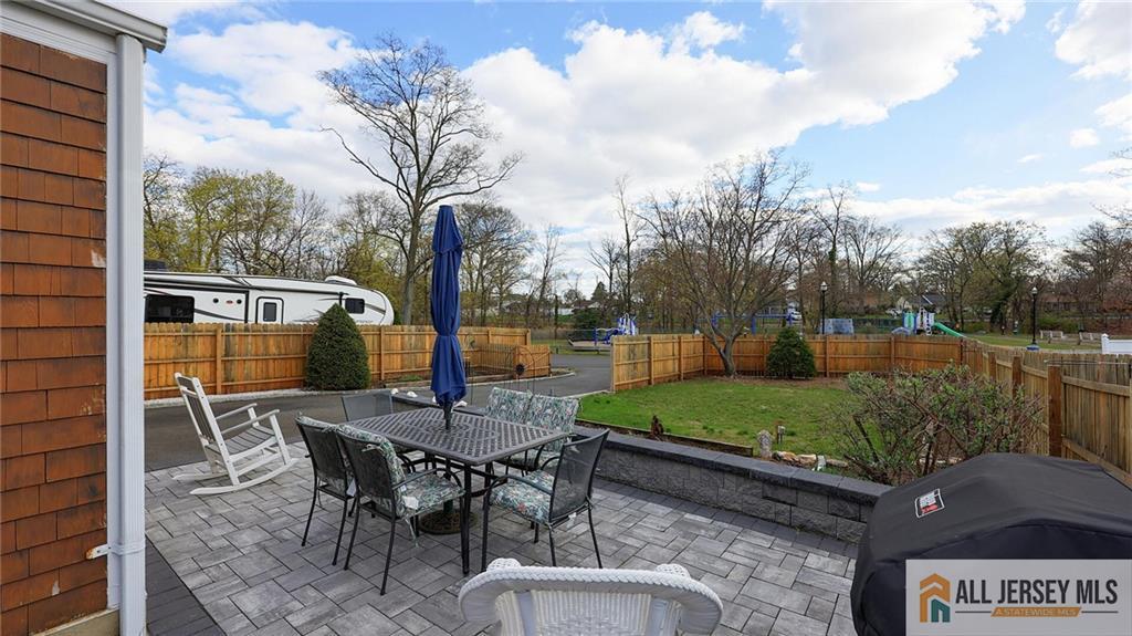 333 Melrose Avenue Middlesex, NJ 08846 - Photo 33 of 36 a view of a patio with table and chairs and potted plants