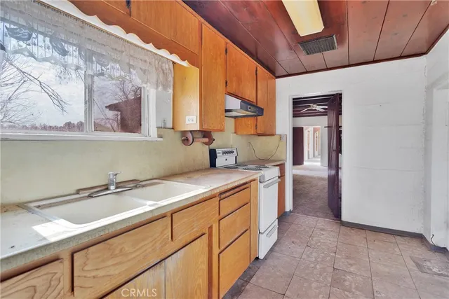 a bathroom with a sink toilet and mirror