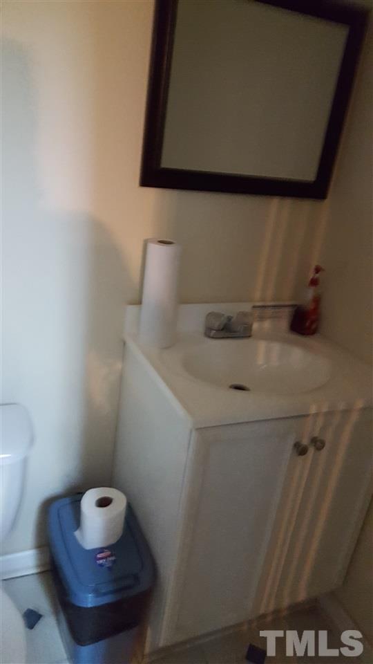 801 Coleman Street Raleigh, NC 27610 - Photo 9 of 12 a bathroom with a sink and a toilet