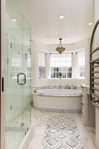 a bedroom with a large bed and a flat screen tv