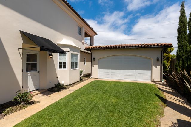 a bathroom with a granite countertop bathtub sink and mirror