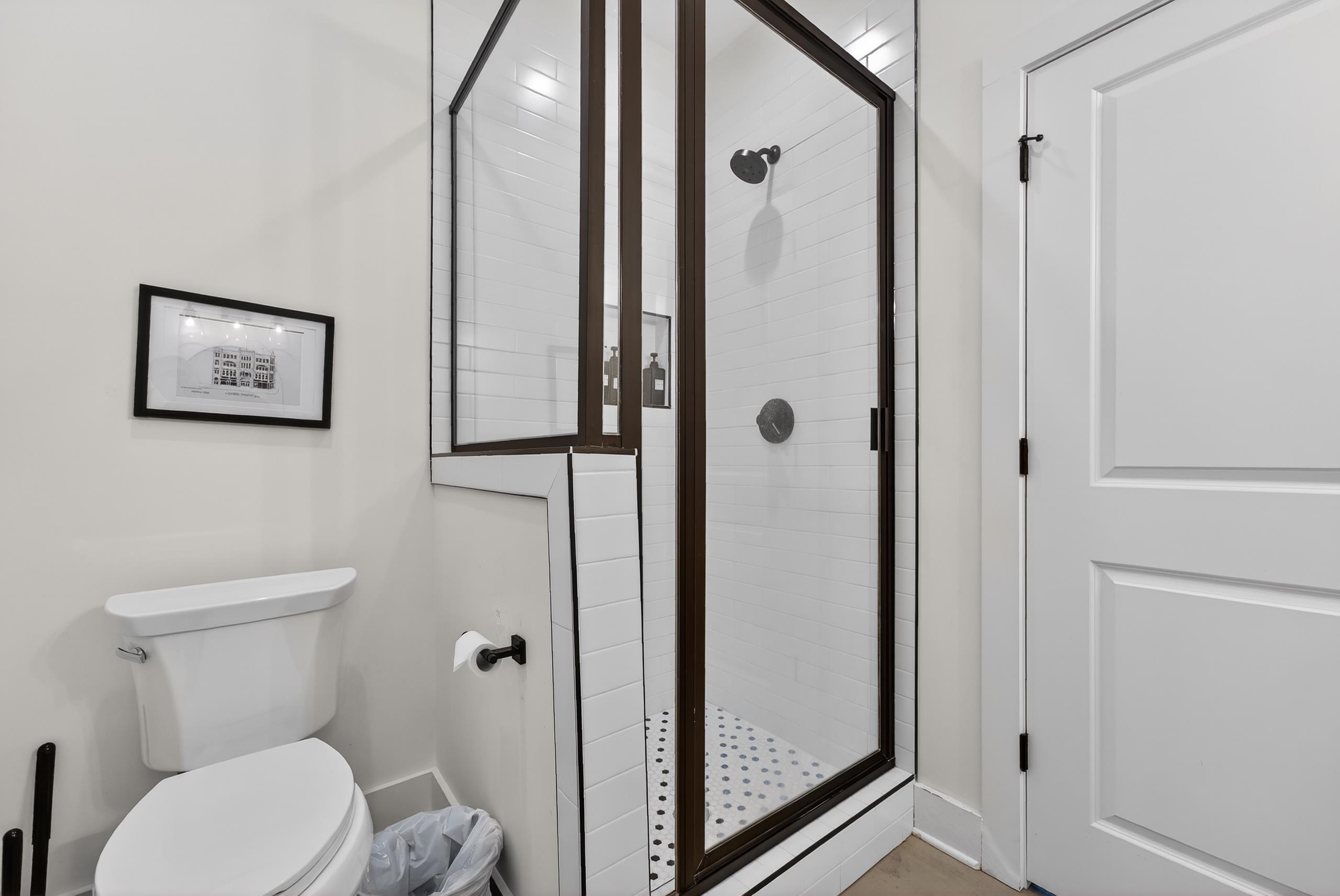 668 Hawthorne Street Memphis, TN 38107 - Photo 14 of 24 Full bathroom with a stall shower and toilet