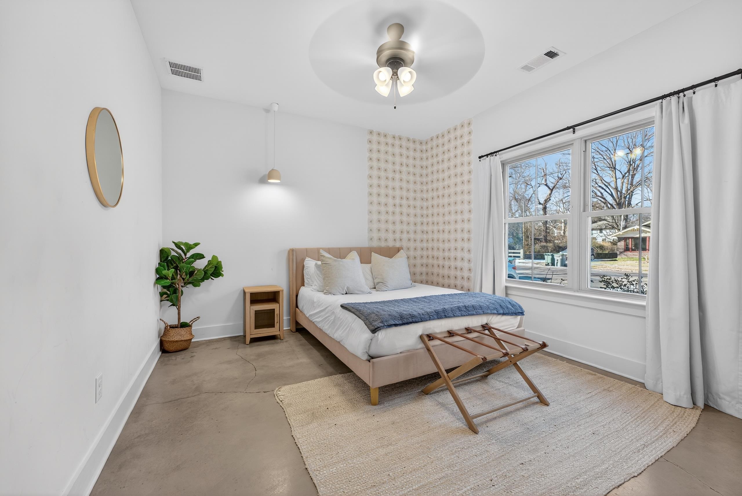 668 Hawthorne Street Memphis, TN 38107 - Photo 19 of 24 Bedroom featuring finished concrete floors and ceiling fan