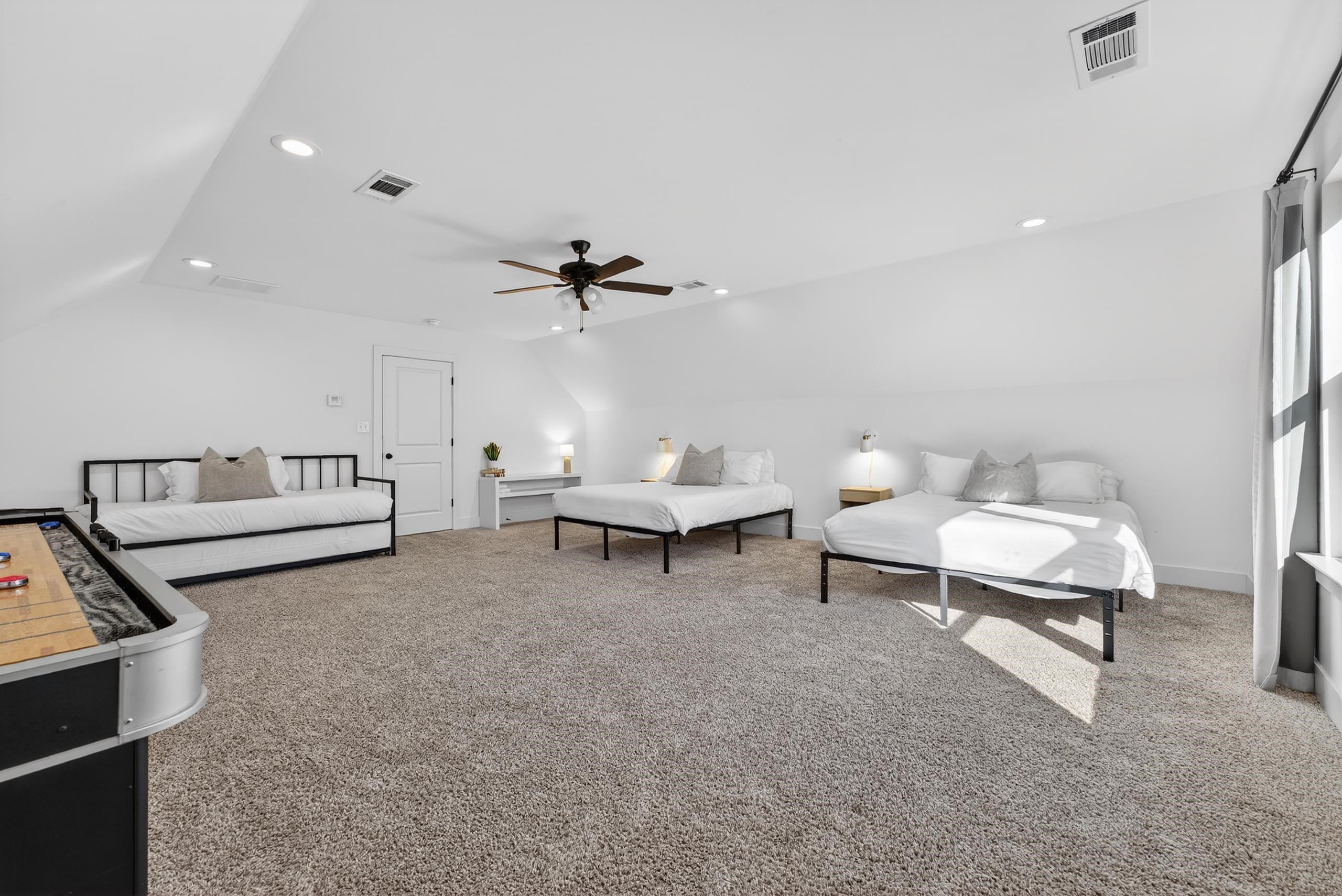 668 Hawthorne Street Memphis, TN 38107 - Photo 22 of 24 Bedroom with light colored carpet, recessed lighting, lofted ceiling, and ceiling fan
