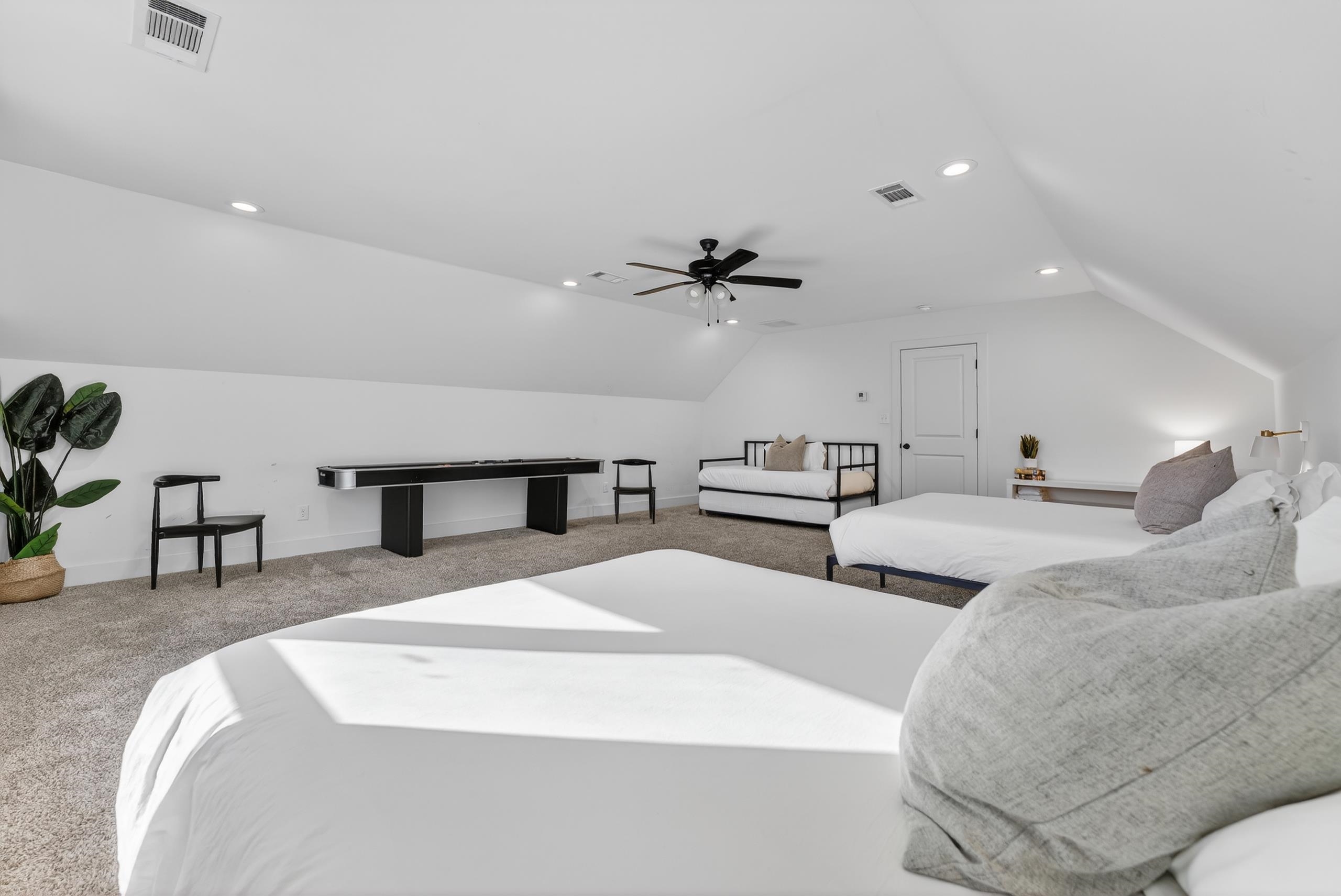 668 Hawthorne Street Memphis, TN 38107 - Photo 23 of 24 Bedroom with light colored carpet, recessed lighting, vaulted ceiling, and ceiling fan